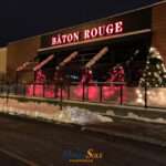 Attico fixed motorized awning with durable aluminum frame and high-quality vinyl fabric, designed for commercial outdoor spaces.